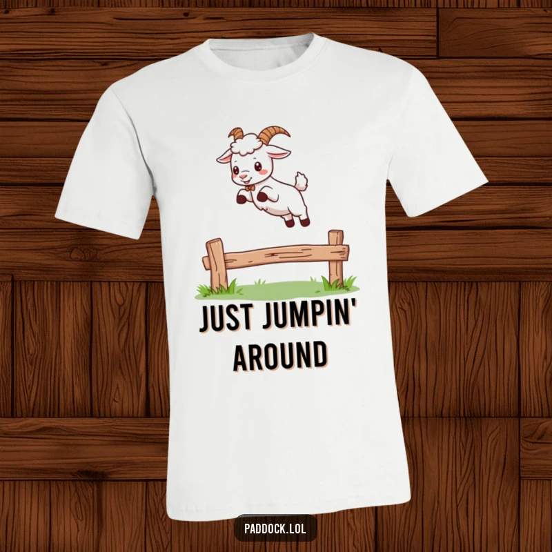 Funny t-shirt with a playful goat mid-air, leaping over a small wooden fence, expressing joy and a sense of adventure.