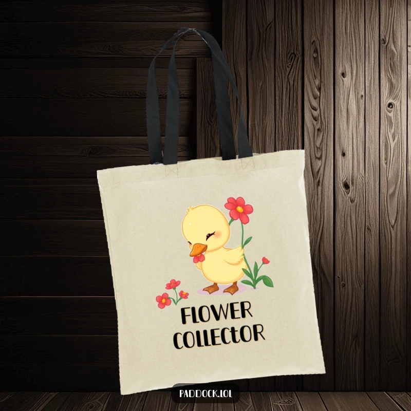 Funny Tote Bag showcasing a curious duckling pecking at a bright red flower, a stylish and humorous accessory.